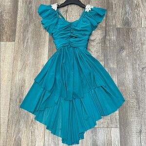 Girls Weissman Dance Flutter sleeve dress with ruched mesh overlays.  Like new